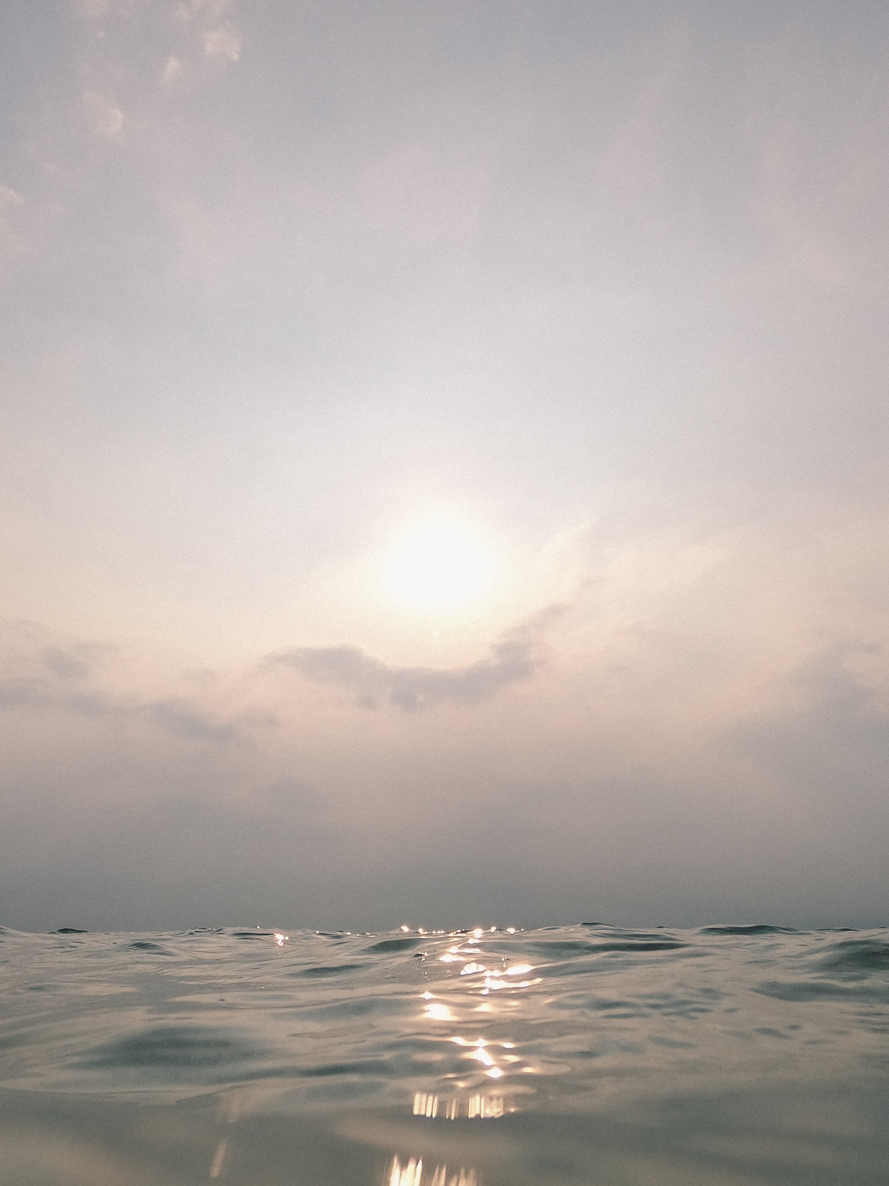 Sunlight in Sky and Calm Sea